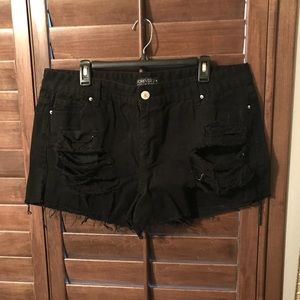 These are just a pair of black ripped jean shorts.